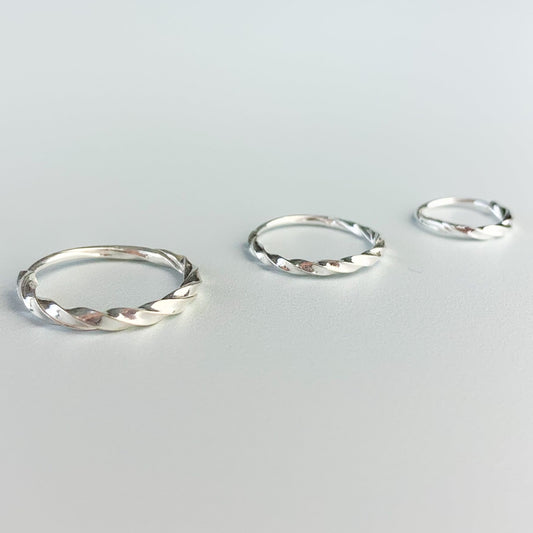 Twisted silver hoop earrings with a sleeper fastening, in three sizes