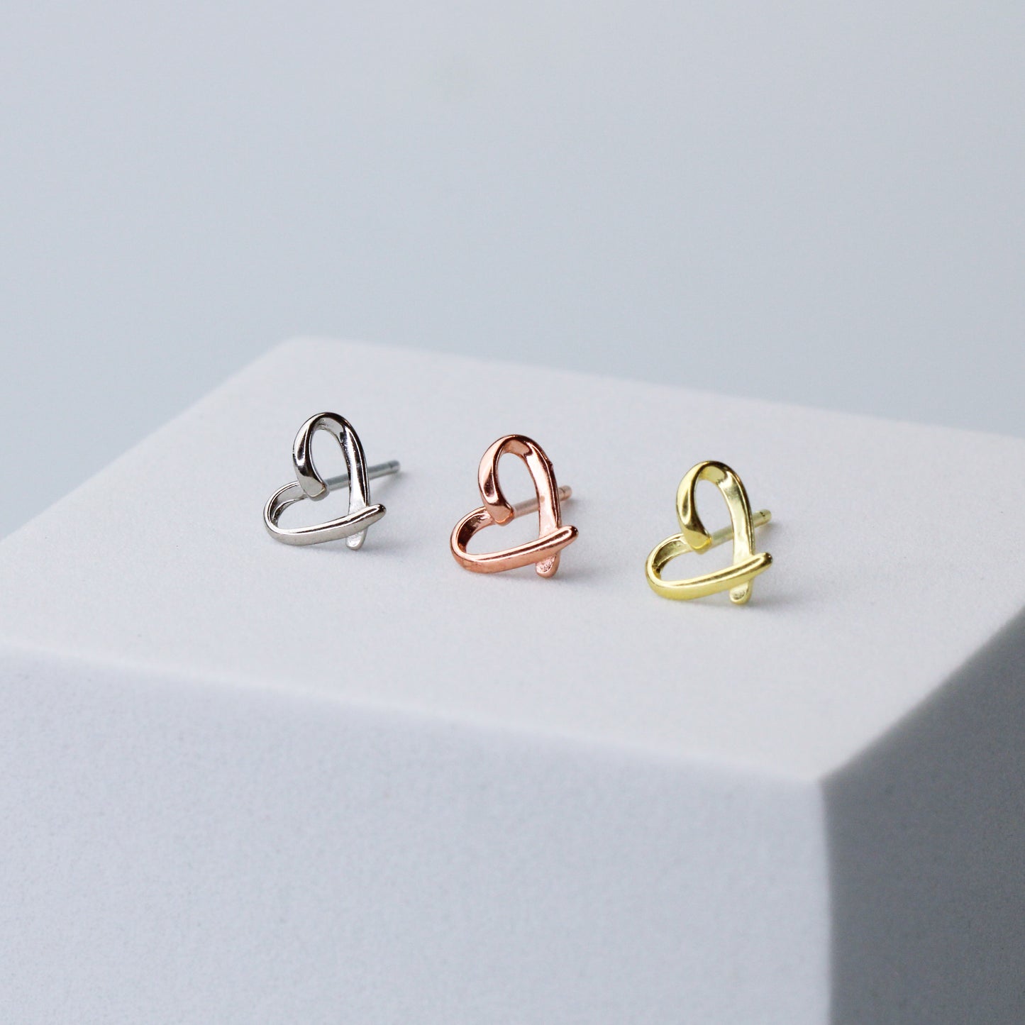Heart stud earrings in silver, gold and rose gold colour