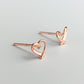Close up of rose gold heart stud earrings