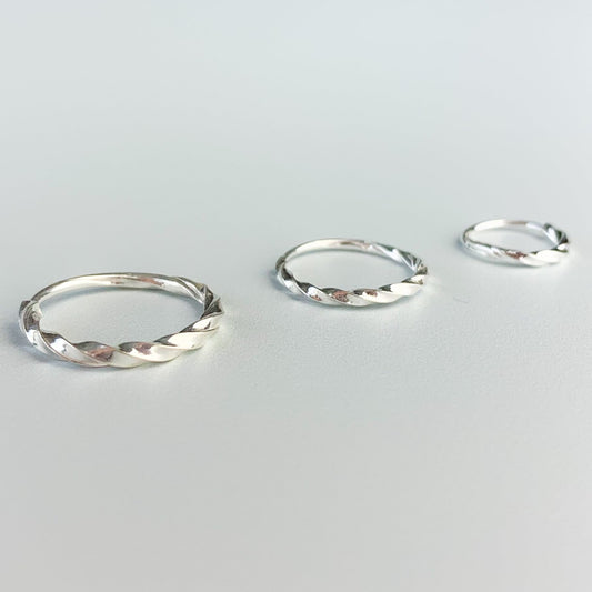 Twisted silver hoop earrings with a sleeper fastening, in three sizes